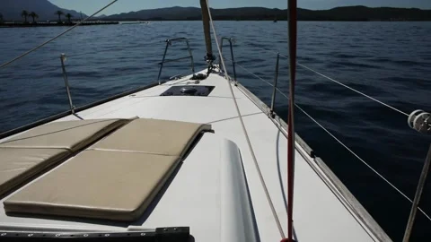 View from the bow of the yacht. White deck of a boat on the blue sea. Stock Footage 248645119