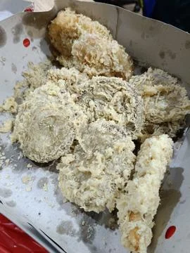 View of a box of crispy fried snacks Stock Photos