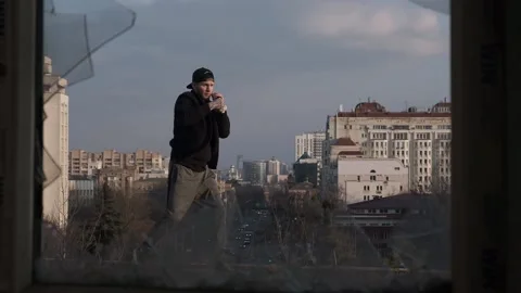 View of a boxer training through a broken window. Stock Footage 133232133