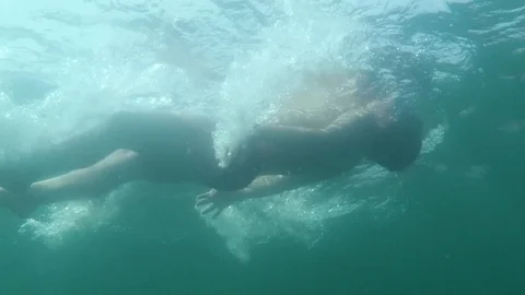 View of the boy floating on the back in water Video stock 96737422