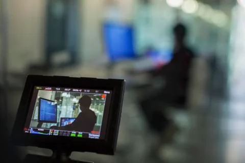 View of boy programming at computer in classroom on digital camera viewfinder Foto stock