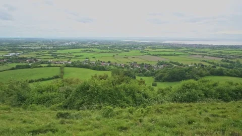 View from Brent Knoll to wards the Bristol Channel, Somerset, England Stock Footage 311009554