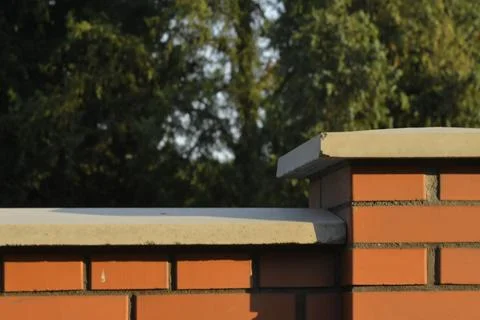 View of brick foundation. Brick wall with white finish. Brick base. Brick Stock-Fotos