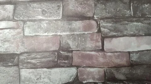 View of The brick pattern is reddish brown and gray with dark grout lines Fotos de archivo