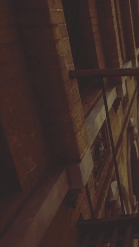 View of a brick wall and railing in an urban setting at night Stock Footage 331678518