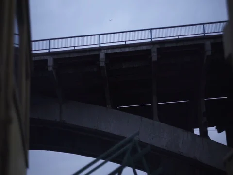 View of the bridge from a boat at twilight Stock Footage 71863224