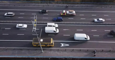 View of the bridge carriageway from above at an angle, pedestrians and cyclists Stock Footage 142120280