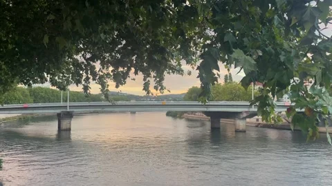 View of a bridge crossing the Rhône River in Lyon, with the cityscape of Lyon Stock Footage 344391569