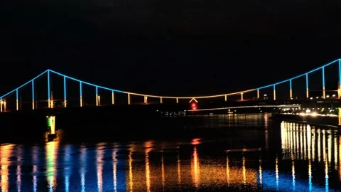 View of the bridge glowing in different colors. Beautiful illumination on bridge Video stock 132277096