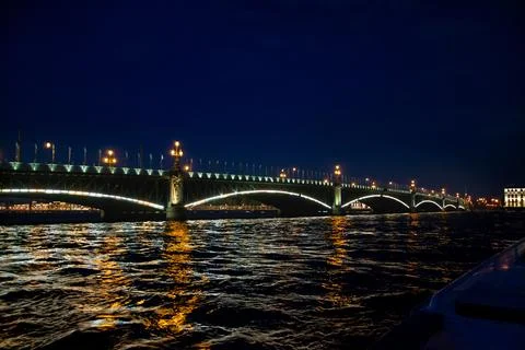 View of the bridge over the Neva river at night in St. Petersburg Stock Photos