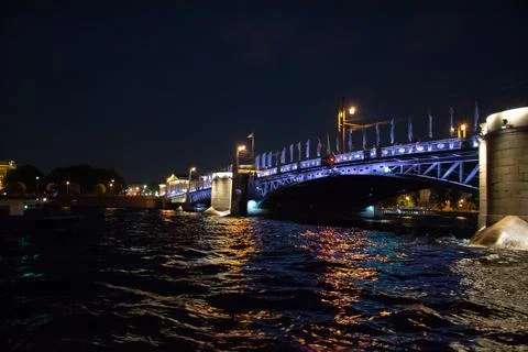 View of the bridge over the Neva river at night in St. Petersburg Stock Photos