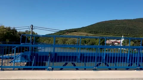 View of the bridge over the river and the surroundings from a moving car Stock Footage 209882128