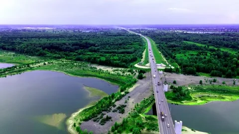 View of the bridge over the river, drone flight. view of the forest and the Stock Footage 266908256