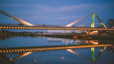View of the bridge over the river by night Stock Photos