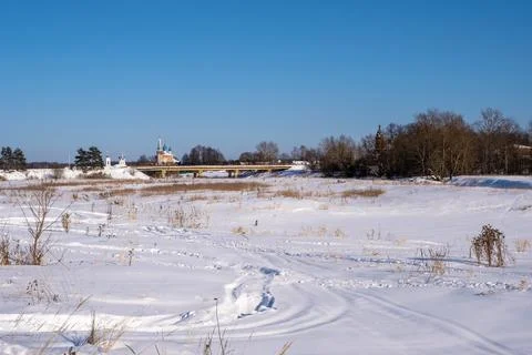 View of the bridge over the river Teza and the churches of the village of Dun Stock Photos
