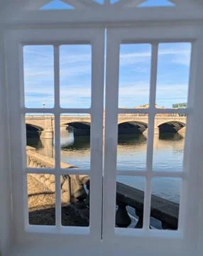 View of a bridge over water from a window Stock Photos