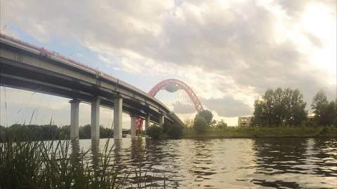 View of bridge from the river bank in summer timelapse 動画素材 79815704