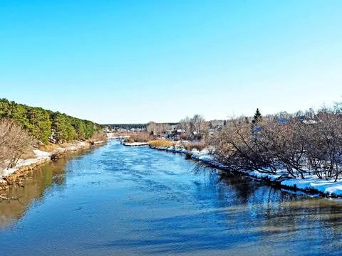 View from the bridge to the river in spring Stock Photos