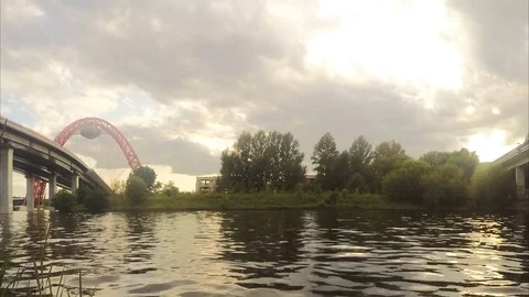 View of bridge from the river in summer timelapse 스톡 동영상 79814150