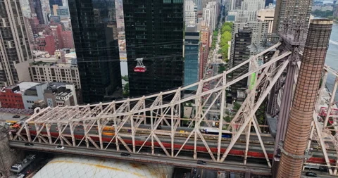 A view of a bridge with a train going over it Stock Footage 247870150