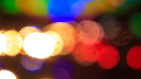 View of bright colourful defocused lights of city illumination Stock Footage 53776042