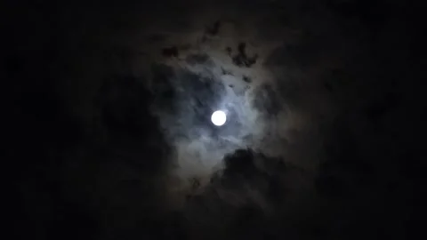 View of the bright moon in a dark sky Stock Footage 192980976