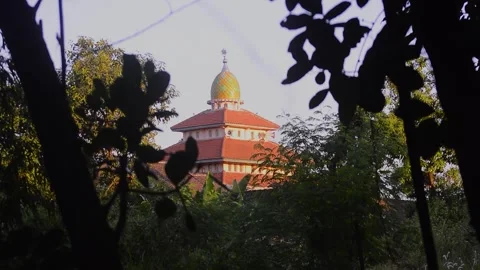 View of the brightly colored roofs and domes of the mosque. 스톡 동영상 292280819