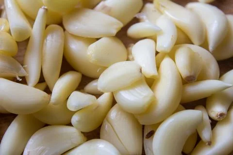 View of broken down garlic pieces. Garlic helps build immunity against cold Stock Photos