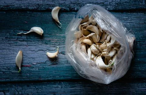 View of broken down garlic pieces. Garlic helps build immunity against cold Stock Photos