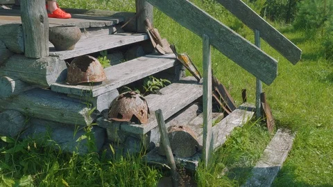 View of broken helmets on stairs of old abandoned chapel Stock Footage 93810163