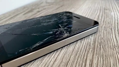 View of the broken phone screen. Cracked glass. A broken smartphone. Stock Footage 340587365