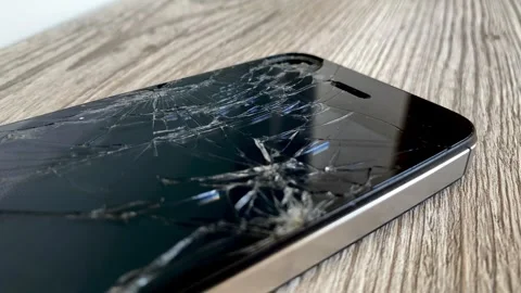 View of the broken phone screen. Cracked glass. A broken smartphone. Stock Footage 340587378