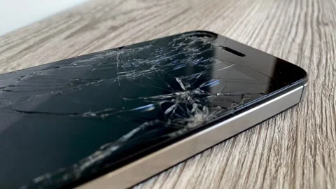 View of the broken phone screen. Cracked glass. A broken smartphone. Stock Footage 340587380
