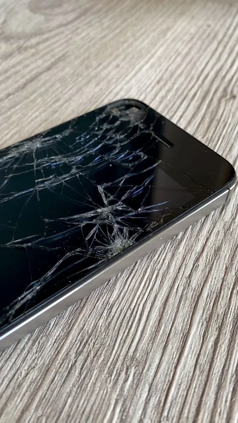 View of the broken phone screen. Cracked glass. A broken smartphone. 4k Stock Footage 344798337