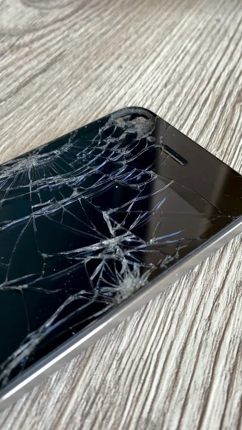 View of the broken phone screen. Cracked glass. A broken smartphone. 4k Stock Footage 344798341