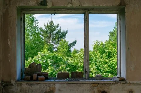 View of the broken window of the destroyed old building Stock Photos