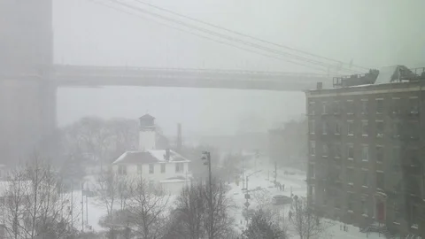 View of Brooklyn Bridge during snowstorm Manhattan New York City usa Stock Footage 84740656