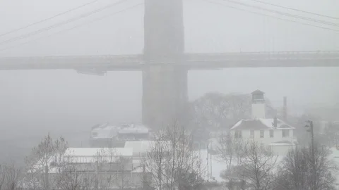 View of Brooklyn Bridge during snowstorm Manhattan New York City usa Stock Footage 84740783