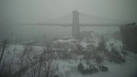 View of Brooklyn Bridge during snowstorm Manhattan New York City usa Stock Footage 84837389