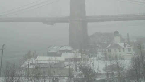 View of Brooklyn Bridge during snowstorm Manhattan New York City usa Stock Footage 84837394