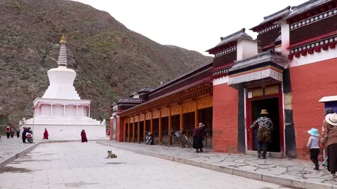 View of the Buddhist stupa, prayer wheels of the temple, monastery Labrang,Tibet Stock Footage 100079862