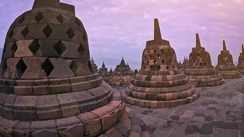View of Buddhist Stupas and statues of Borobudur ancient temple Java Indonesia Vídeo Stock 70925628
