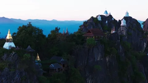 View of Buddhist temple and small houses at Wat Phra Phutthabat Sutthawat in Stock Footage 330870593