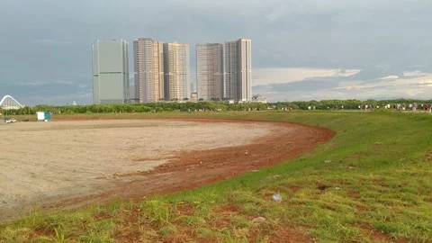 A view of the building and the foreground of the green grass Stock Footage