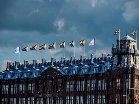 View of the building with different flags on the roof. Fotos de archivo