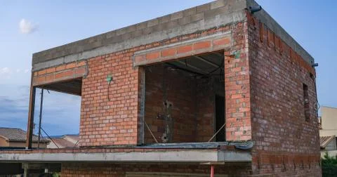 View of the building under construction against the backdrop of blue sky. Stock Photos
