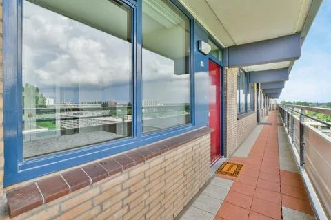 A view of a building with windows and a balcony Stock Photos