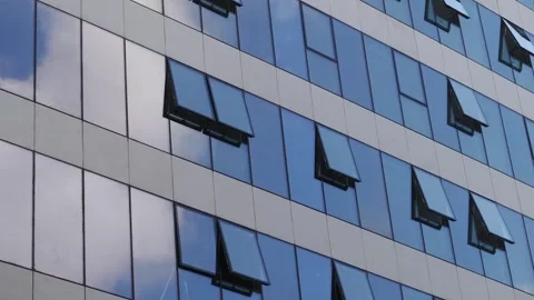 View of building windows with open and closed panes in urban area Vídeos de archivo 346989458