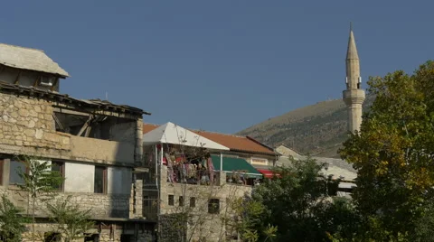 View buildings made of stone and a balcony with scarves in the wind at Mostar Video stock 59432099