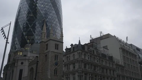 A view of buildings with old architecture besides a modern building. Stock Footage 103257762